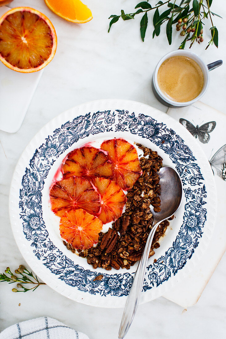 Espresso and chocolate granola bowl with yoghurt and blood oranges