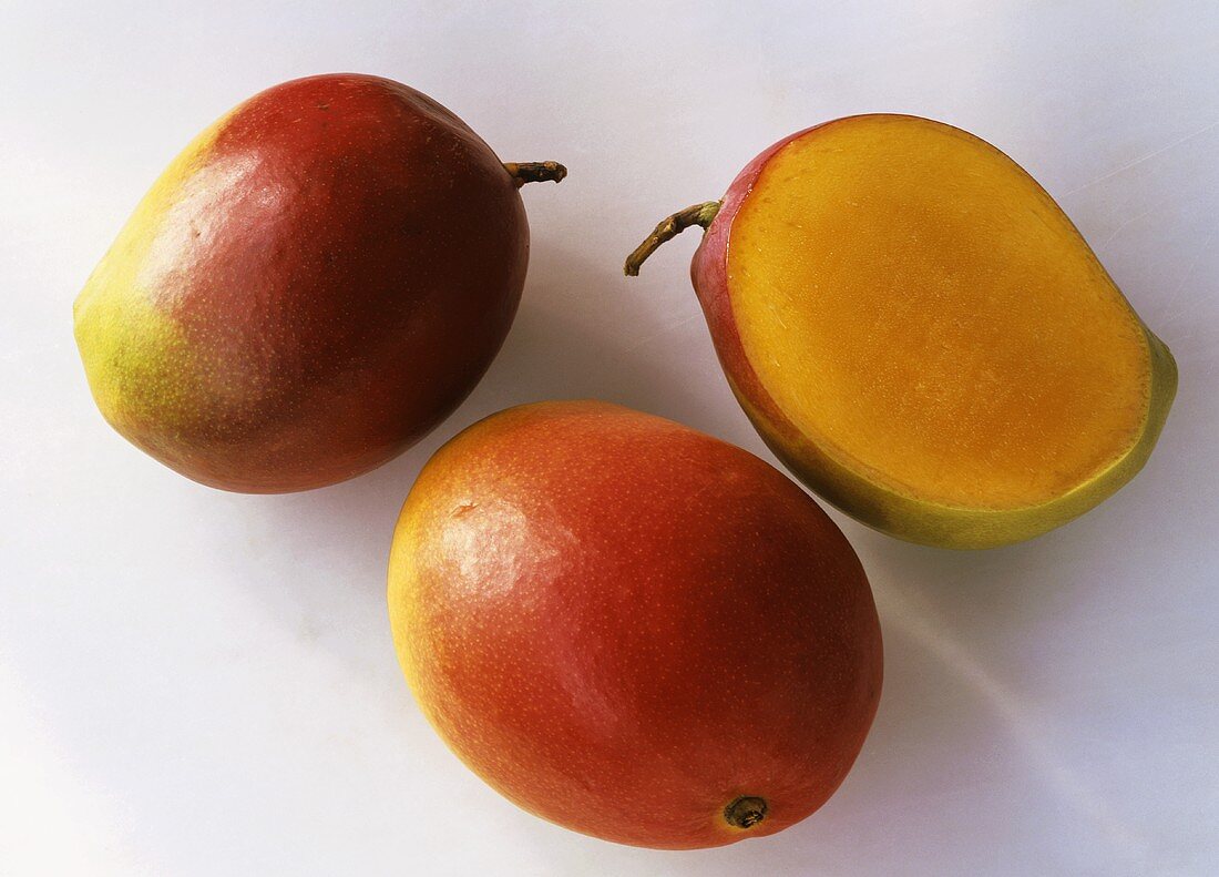 Two whole mangoes and half a mango