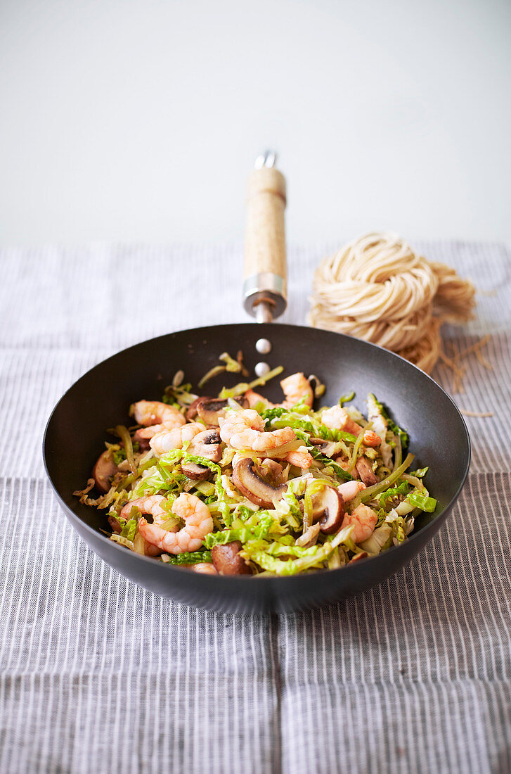 Fried prawns with savoy cabbage and mushrooms