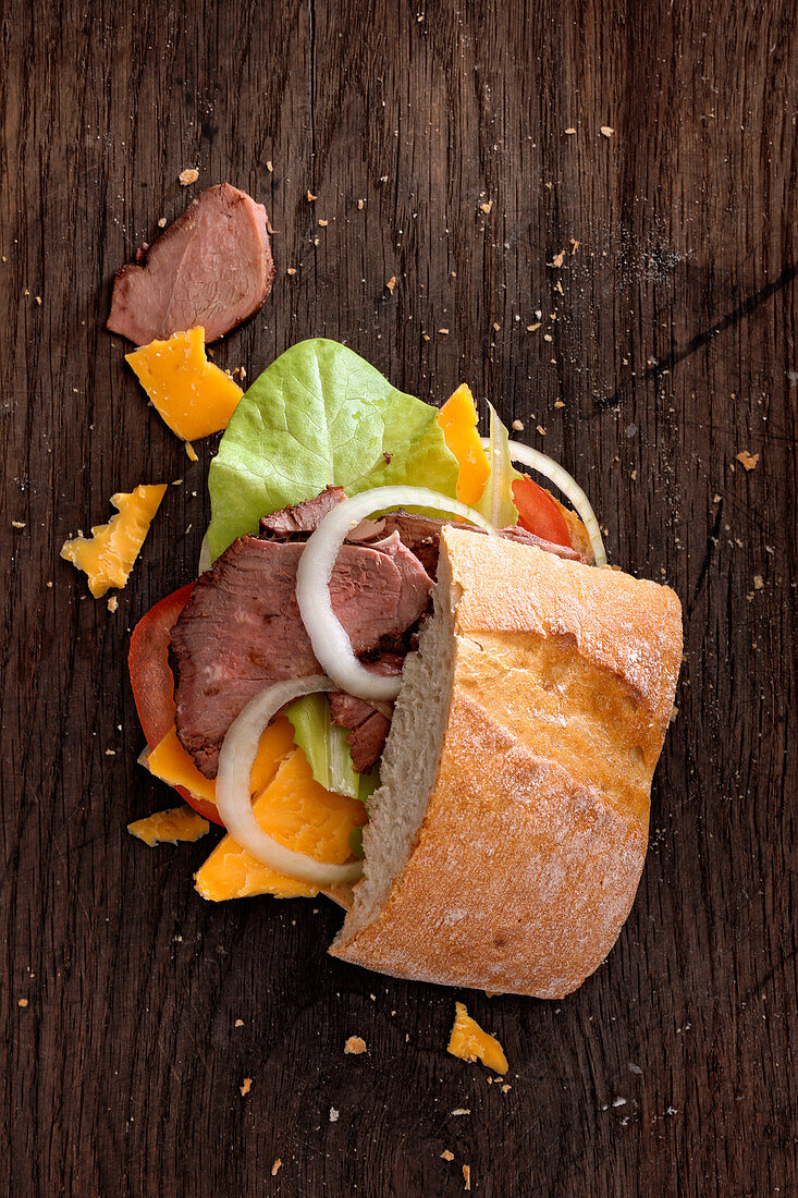 Sandwich with smoked leg of lamb and cheddar cheese