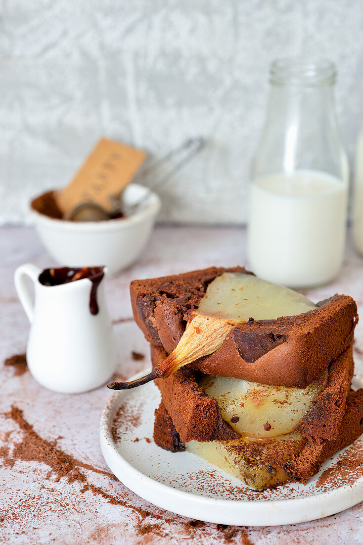 A chocolate loaf cake with sunken pears