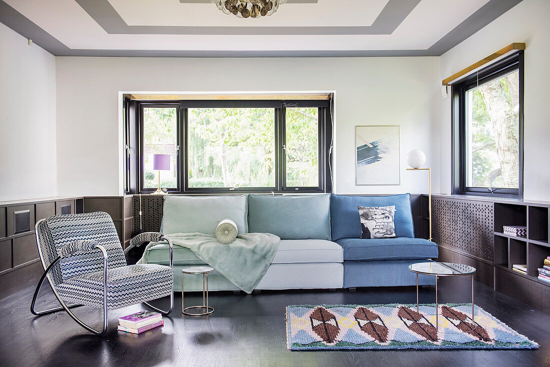 Sofa in shades of blue and green in living room