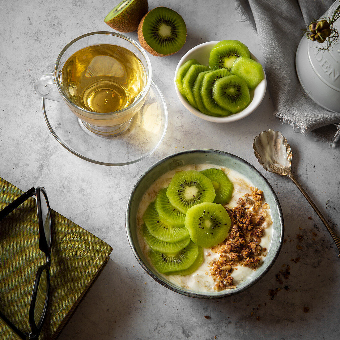 Kiwi fruit yoghurt with granola in breakfast setting