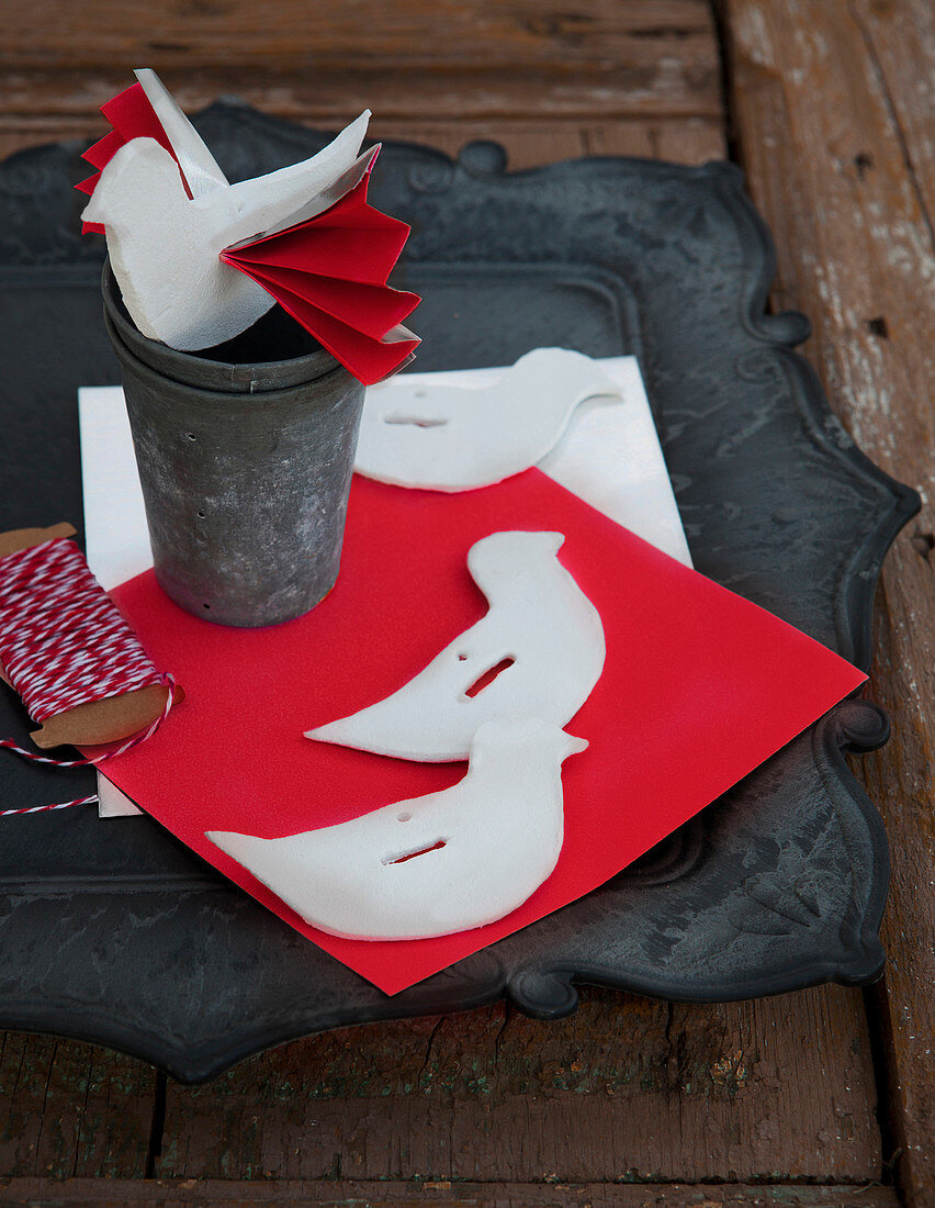 Modelling-clay bird ornaments with paper wings