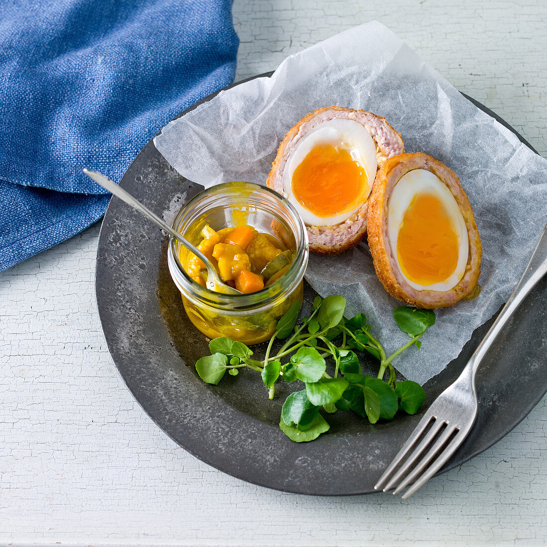 Scotch eggs with a cauliflower pickle and watercress