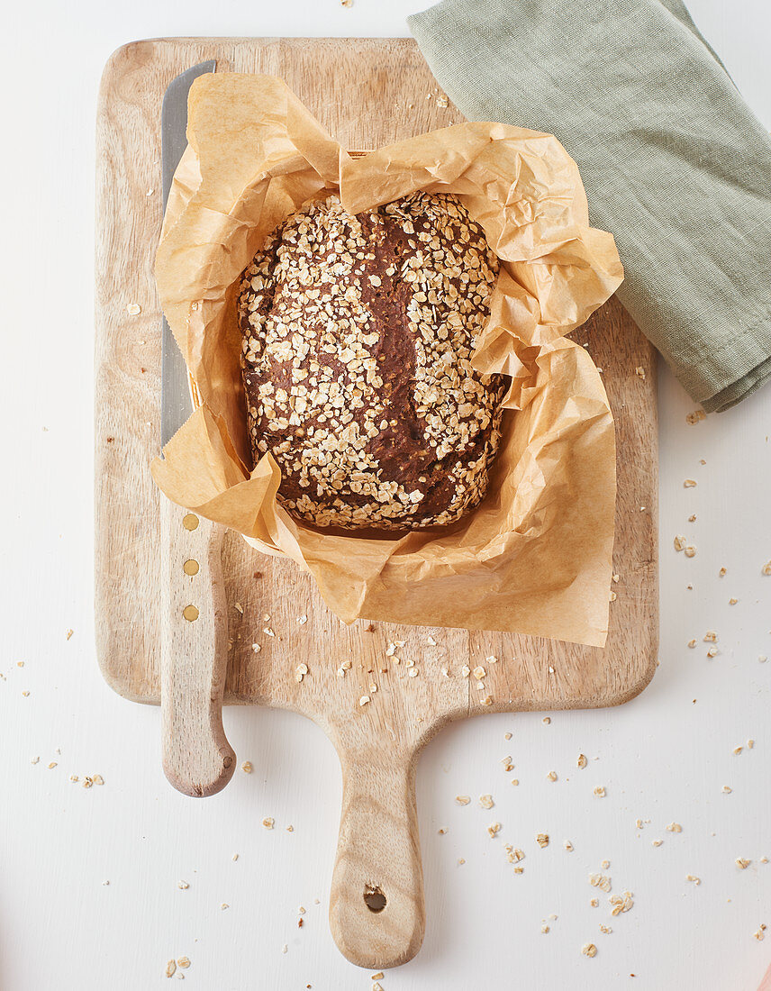 Homemade brown bread with oat flakes