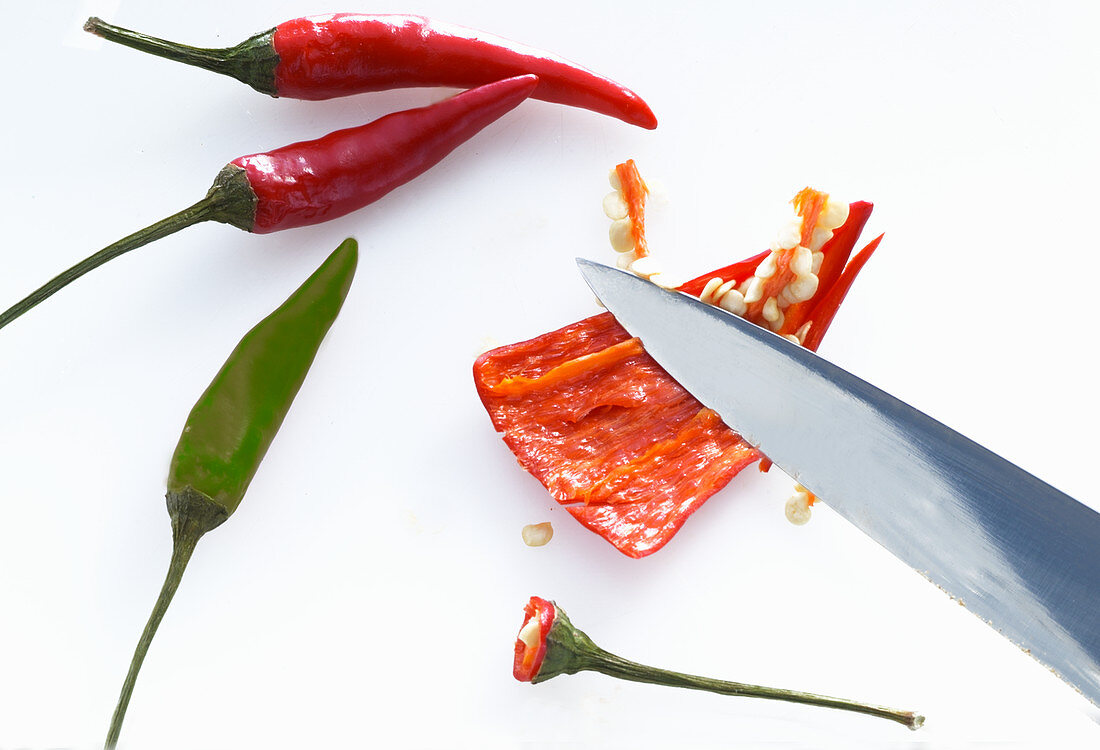 A chilli being deseeded