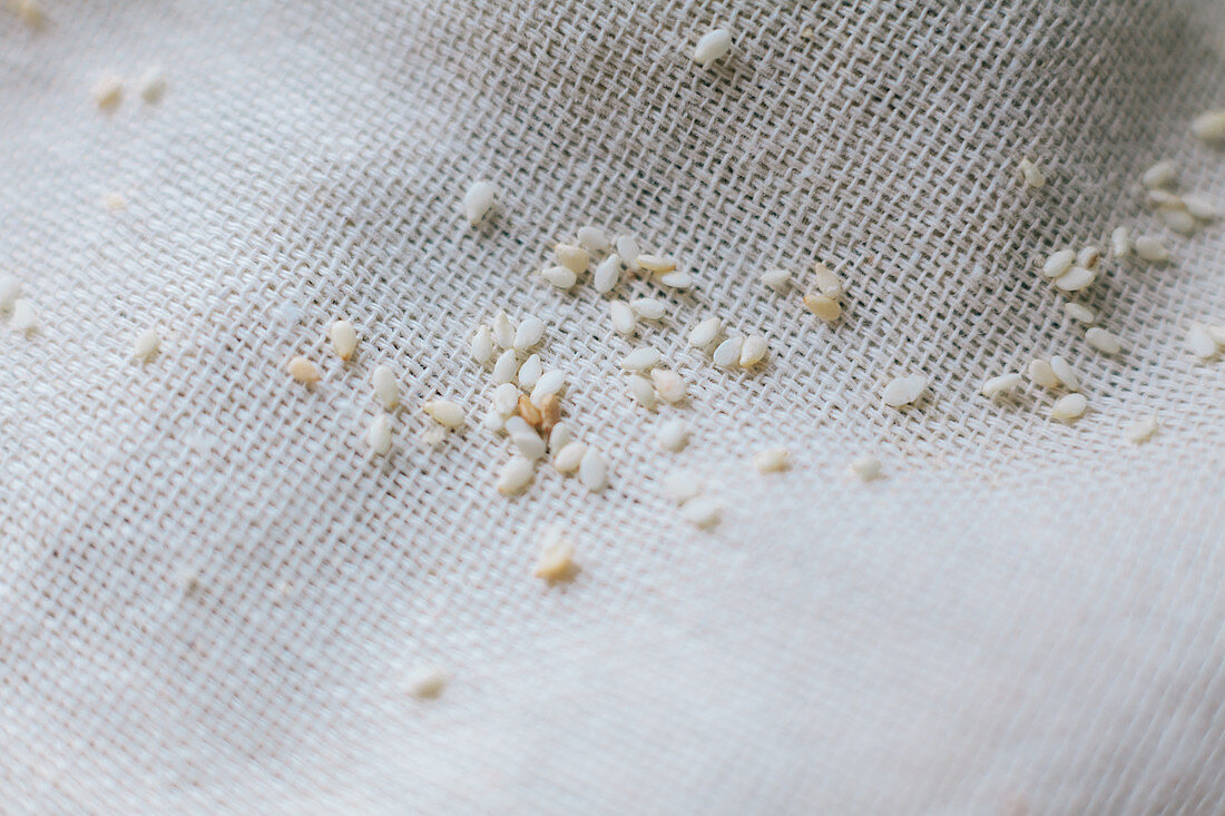 Sesame seeds on a linen cloth (close-up)
