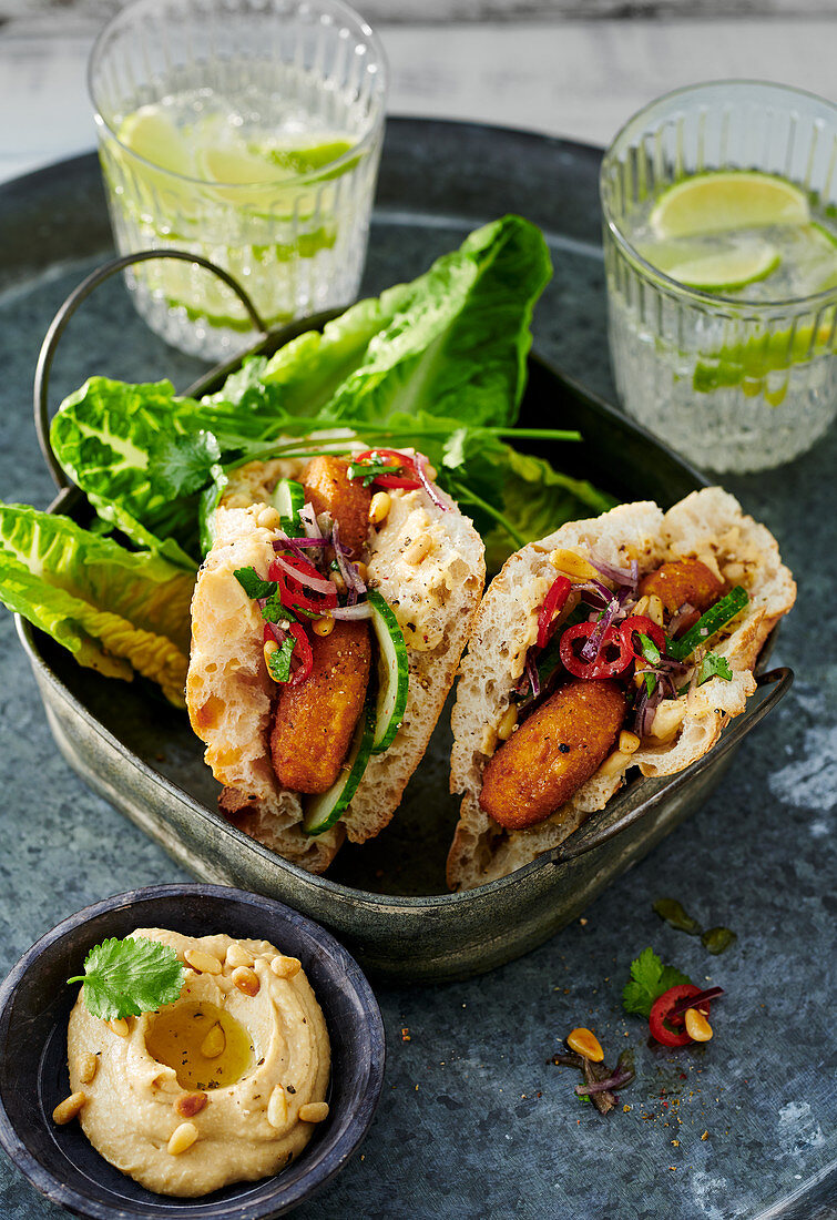 Mini unleavened bread filled with falafel served with cos lettuce and tahini