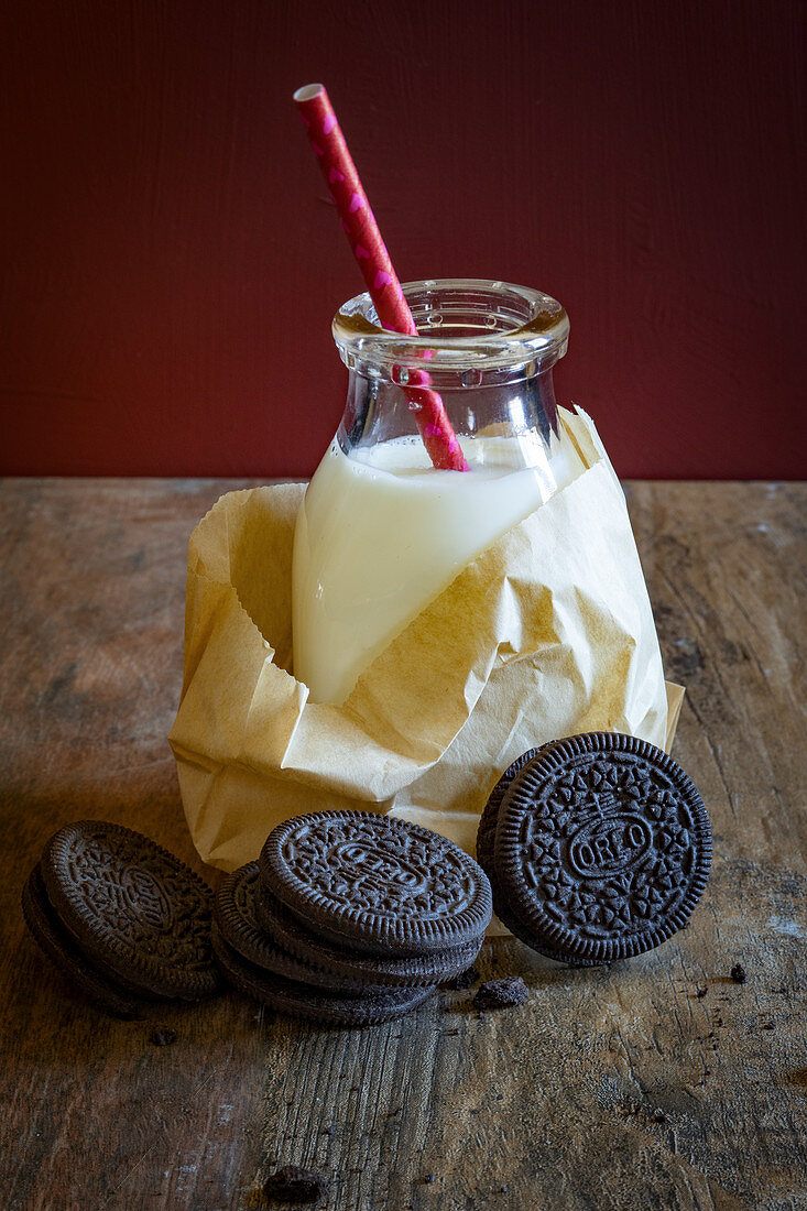 Oreo cookies and a bottle of milk