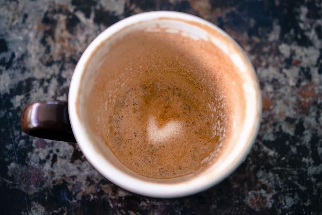 A heart pattern in leftover coffee foam