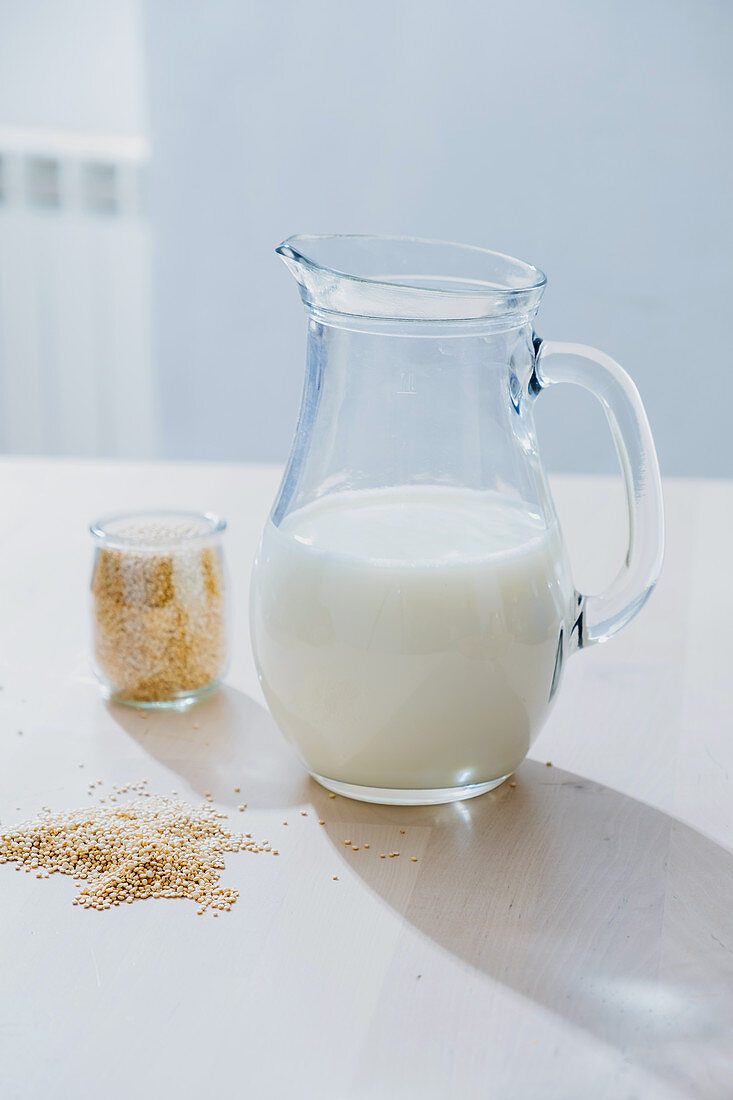 Jar of milk and oatmeal on table