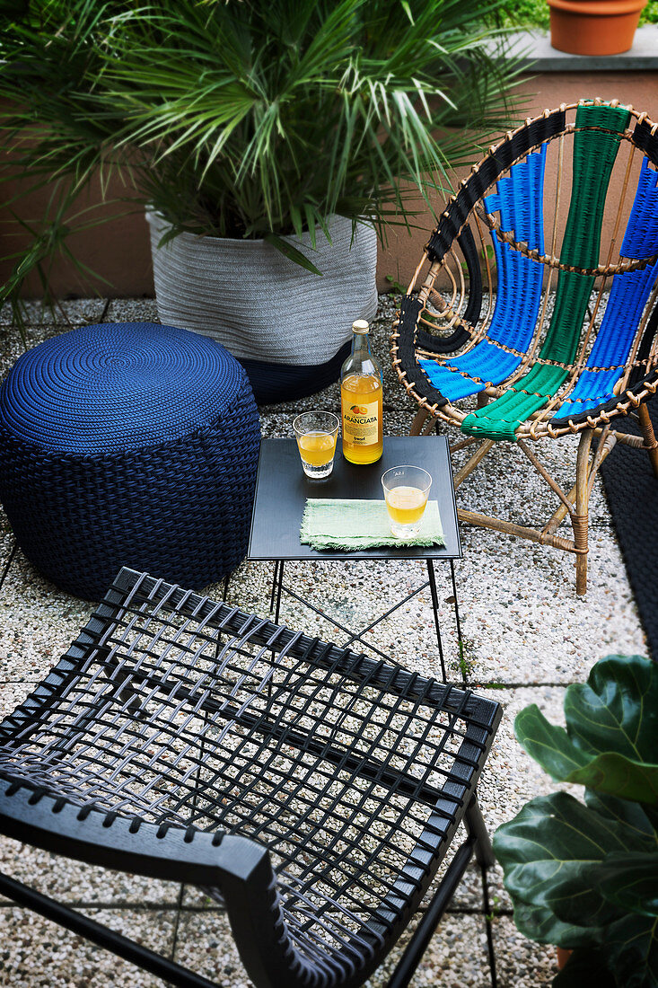 Designer furniture in seating area on summery balcony