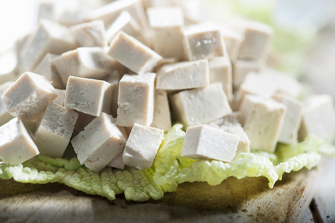 Cubes of tofu on cabbage leaf