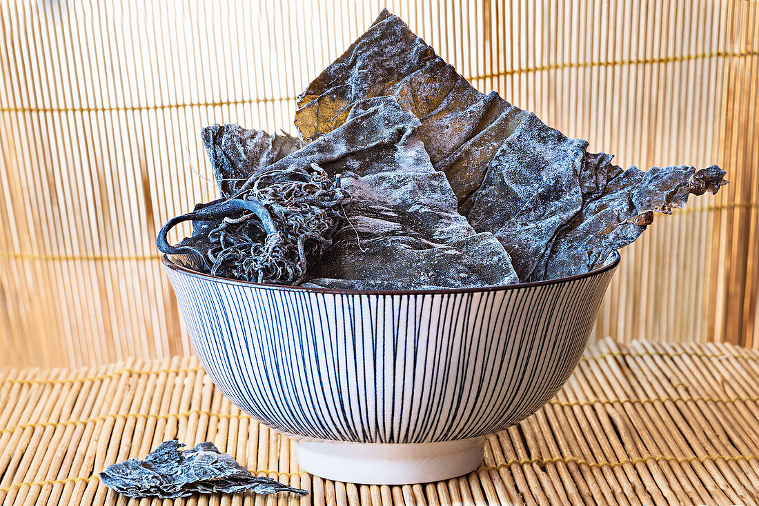 Dried kombu seawead in a ceramic bowl