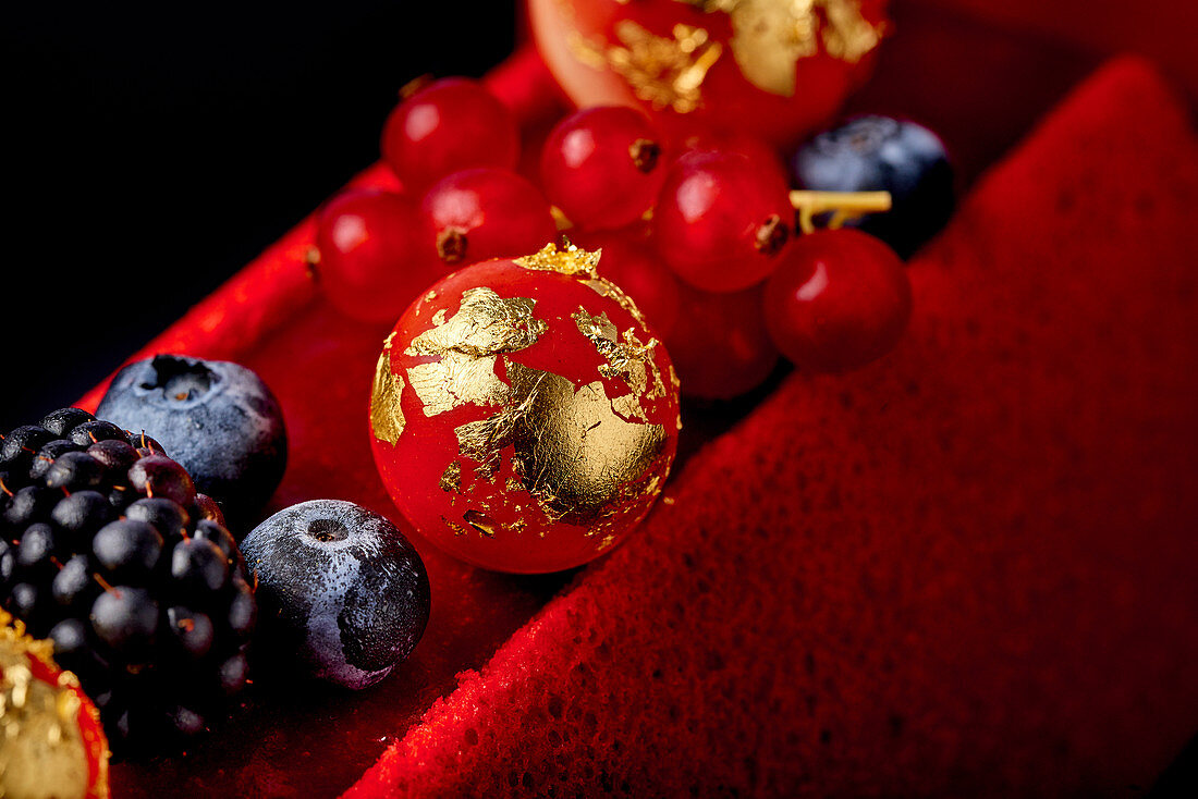 Buche de Noel with berries and gold leaf
