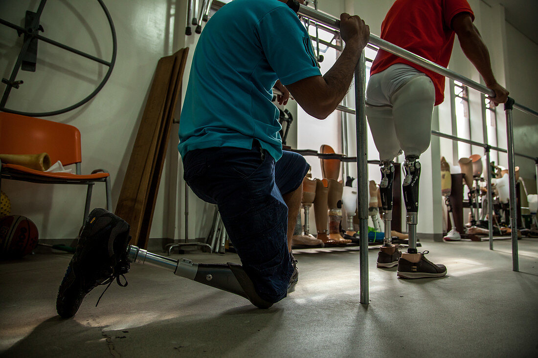 Colombian land mine victims having prosthetic legs fitted