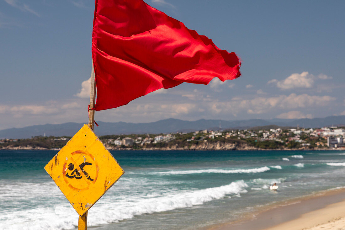Red flag on Pacific Ocean beach, Mexico