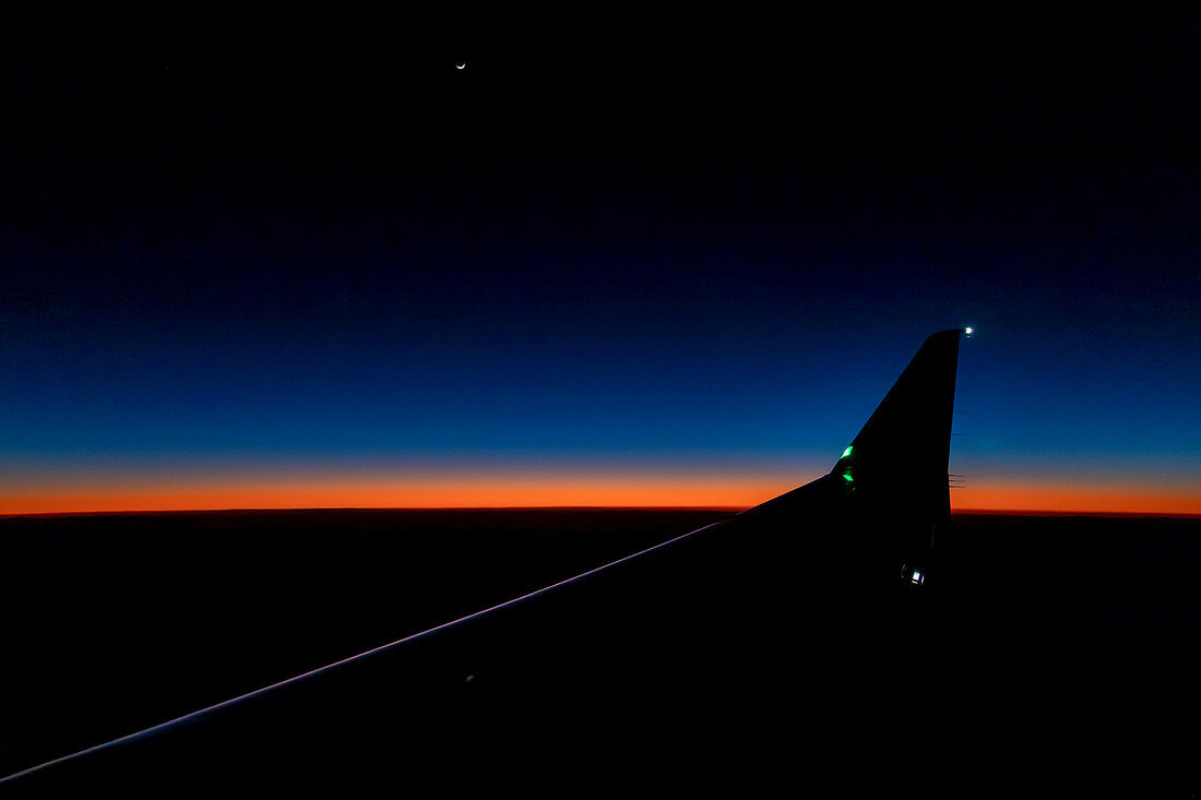 View from passenger jet at sunset