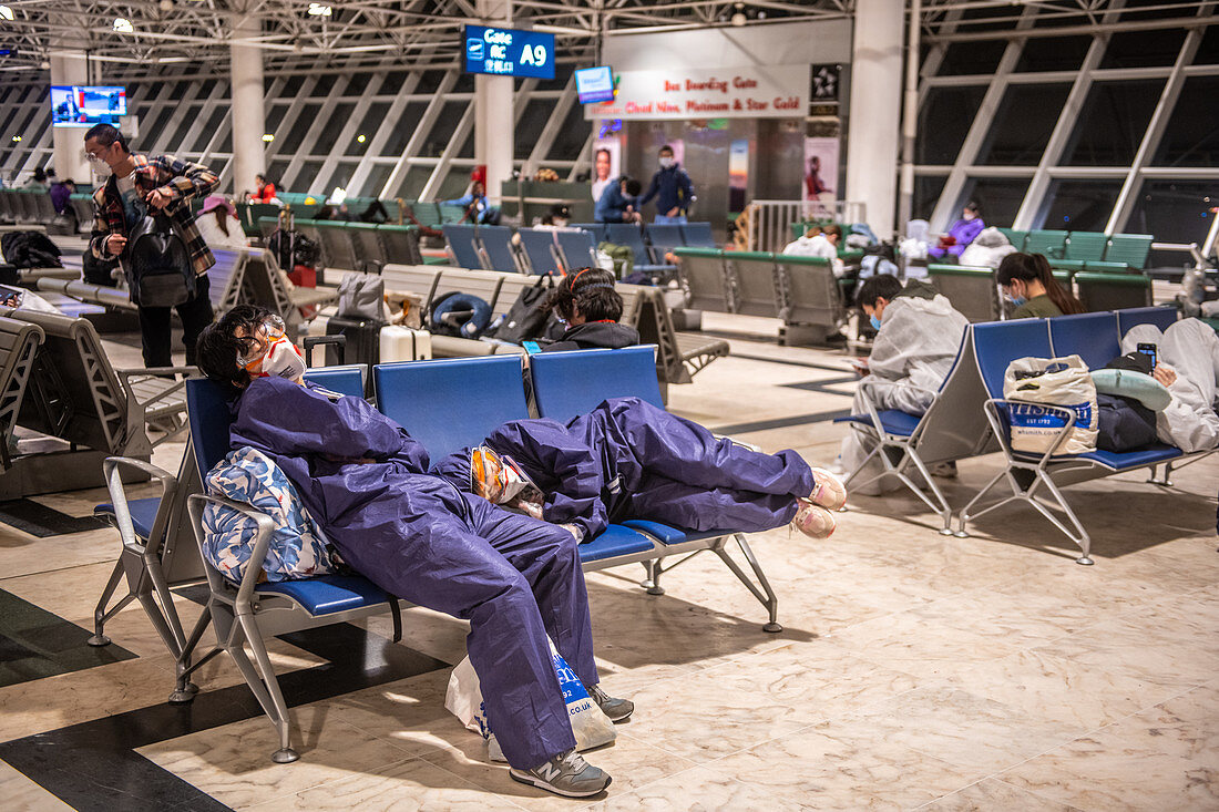Travellers waiting in airport during Covid-19 outbreak