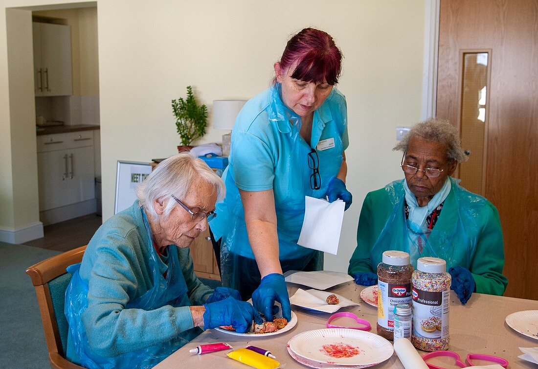 Care home residents making cakes