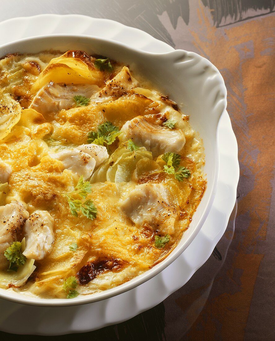 Fish and potato bake with kohlrabi in baking dish