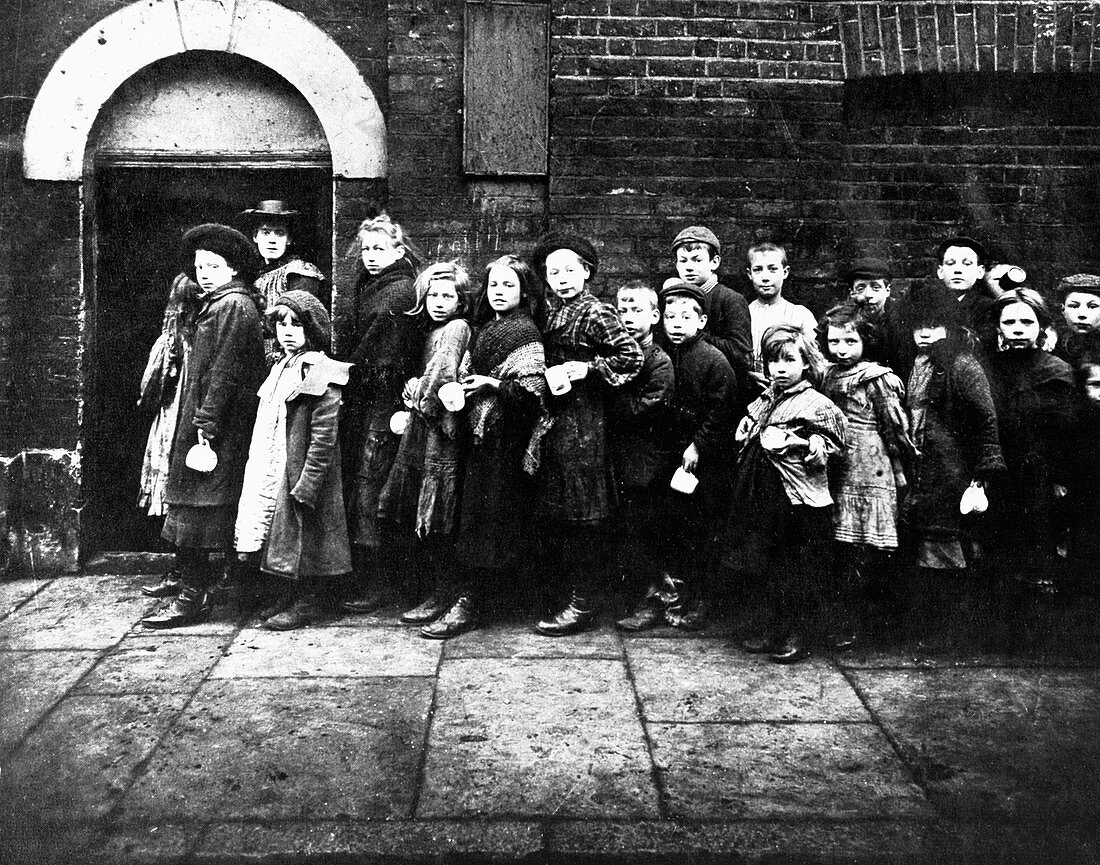 Children queuing for farthing breakfast, London