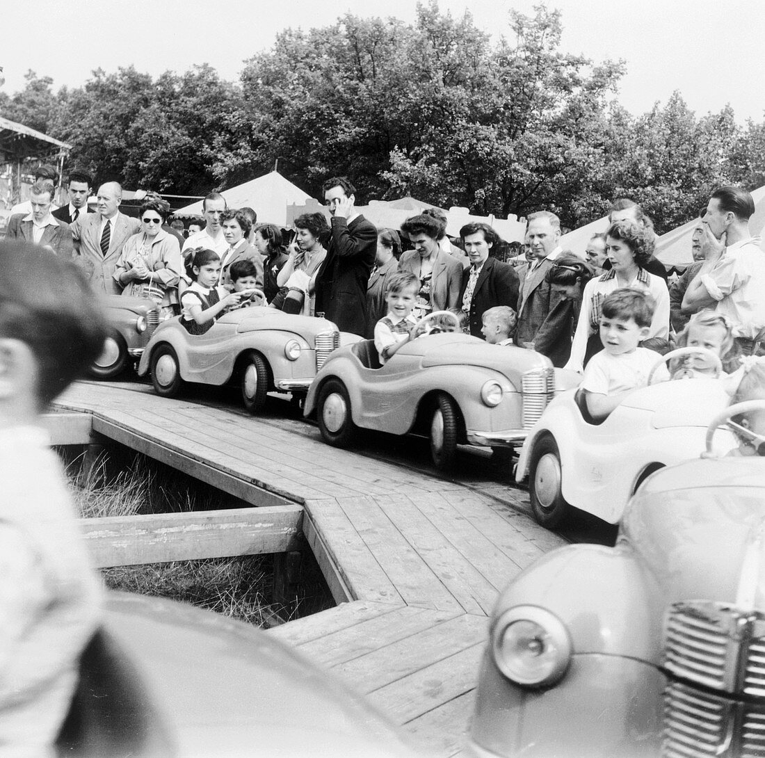 Children on a fairground ride, Festival of Britain, 1951