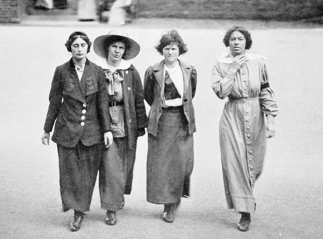 Four suffragettes exercising in the yard at Holloway Gaol
