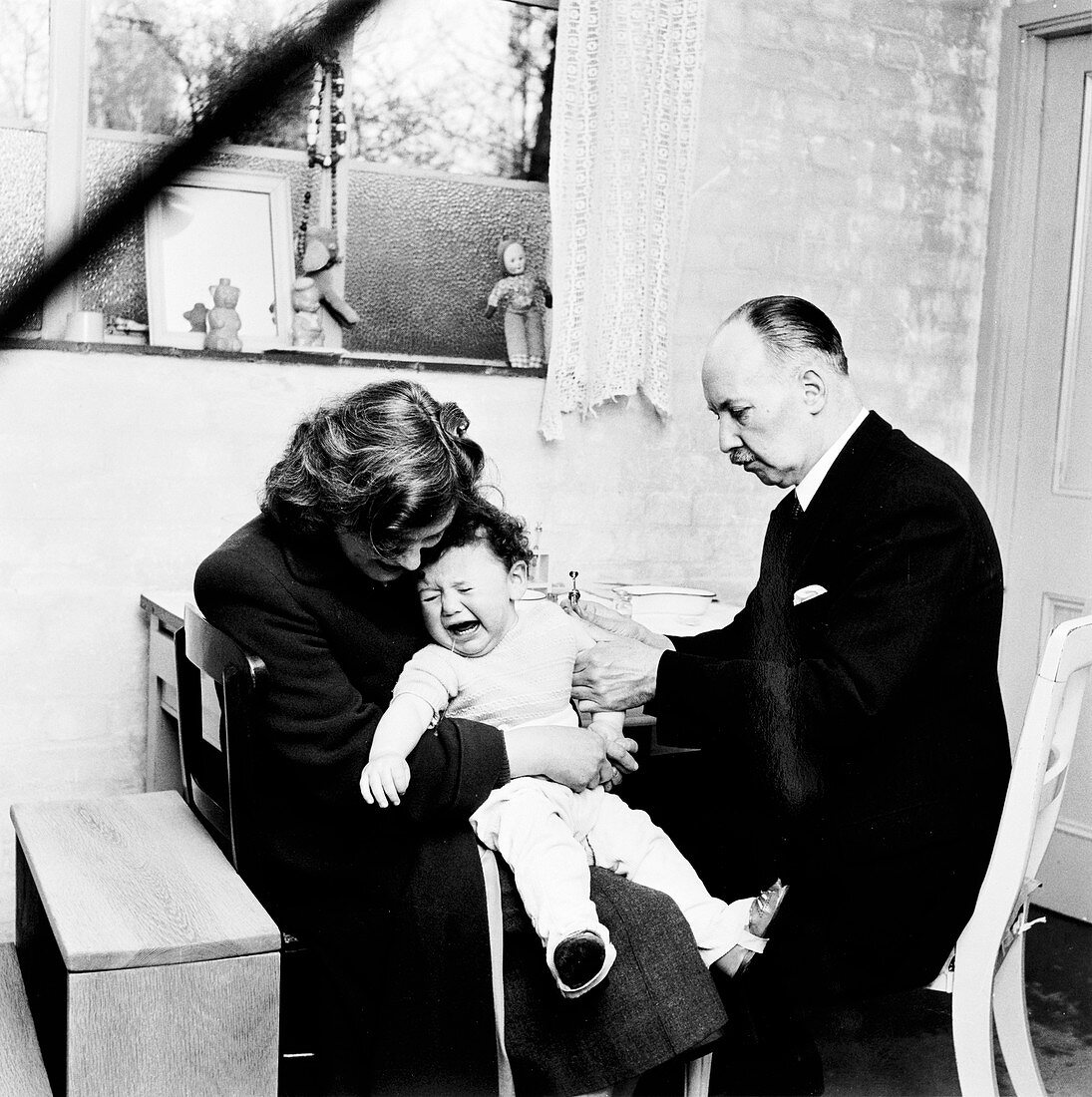 Baby being immunised, London, 1953