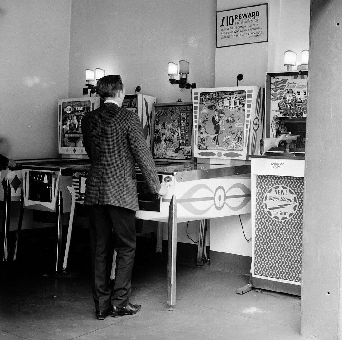 Man playing pinball in a London amusement arcade, c1966-67