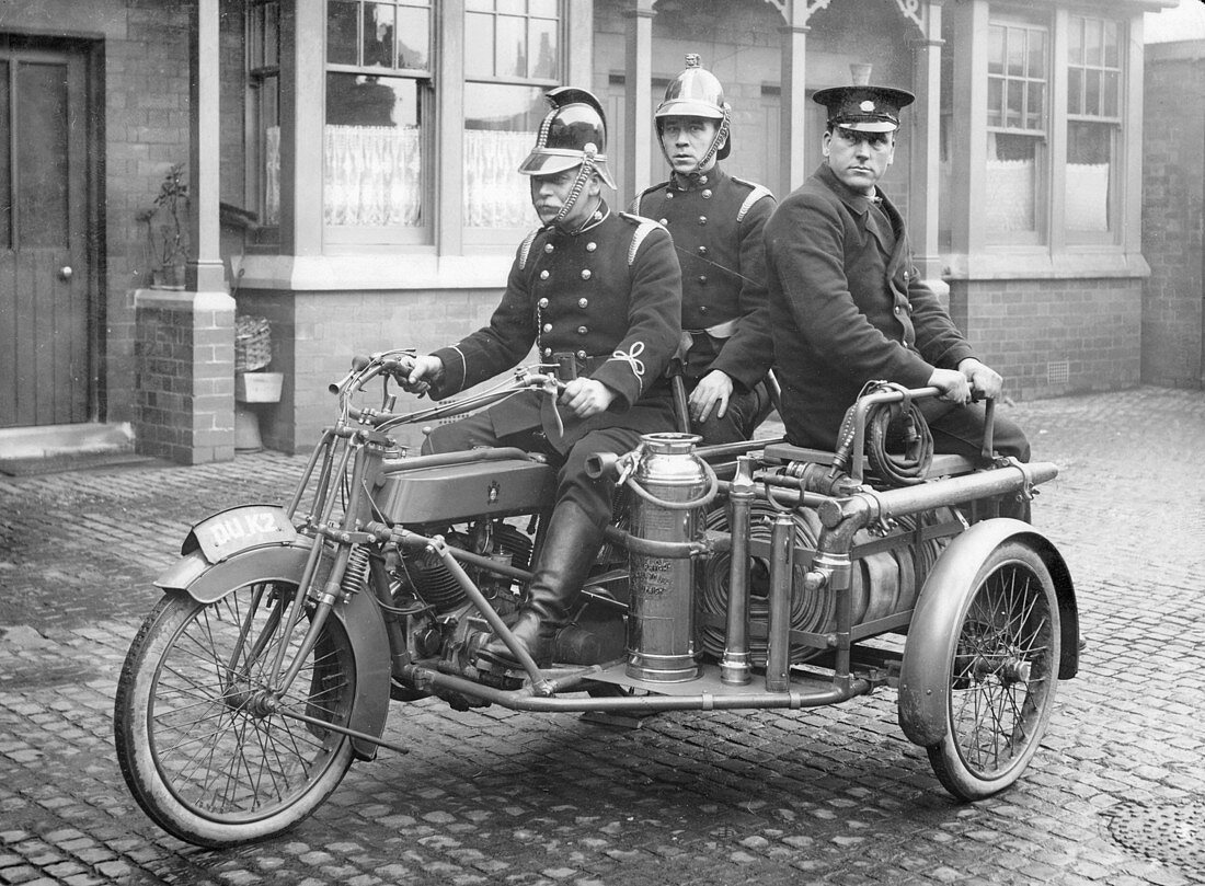 A Rex motorcycle being used by firemen