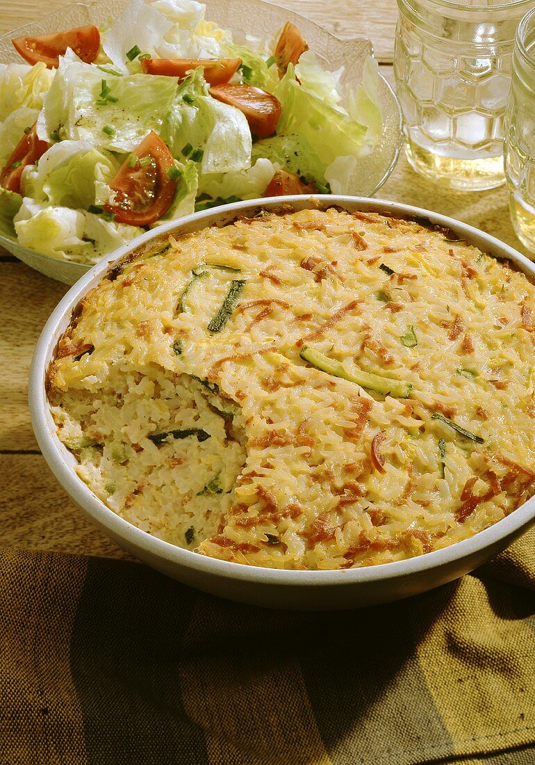 Rice bake with ham and courgette and salad bowl