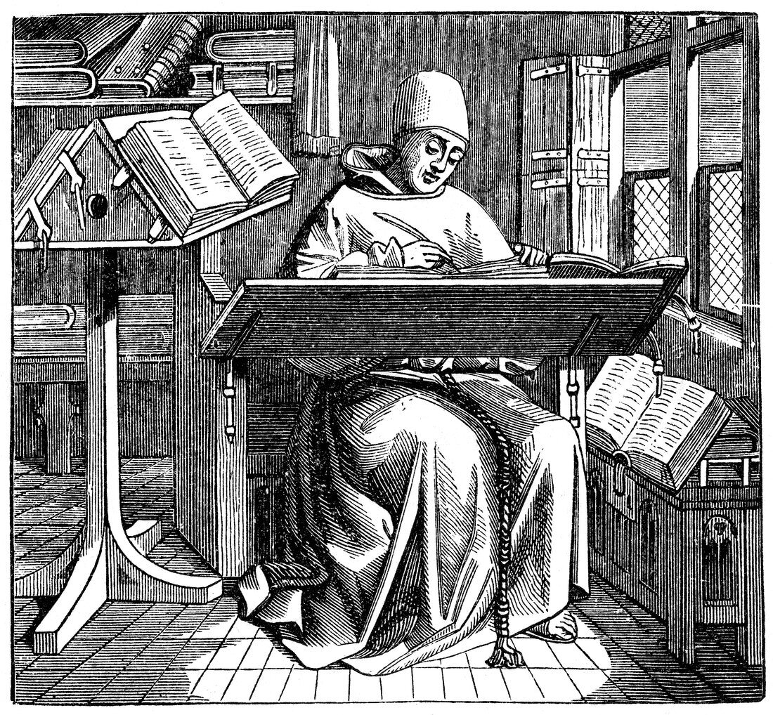Monk at work on a manuscript in the corner of a scriptorium