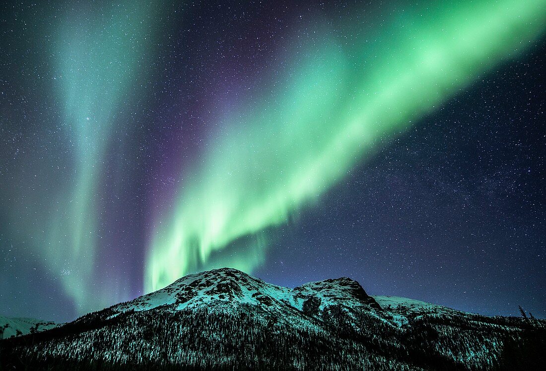 Aurora Borealis over mountain range