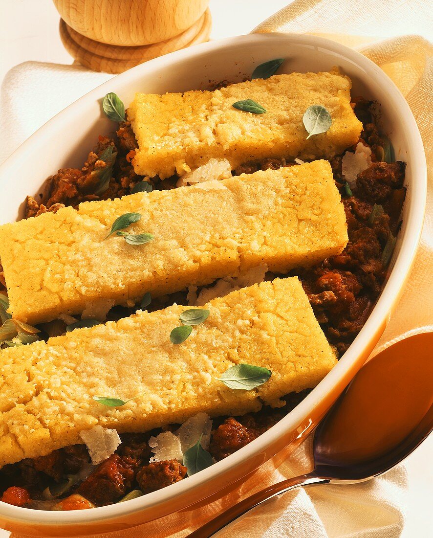 Polenta fritta e ragù (polenta on meat sauce, Italy)