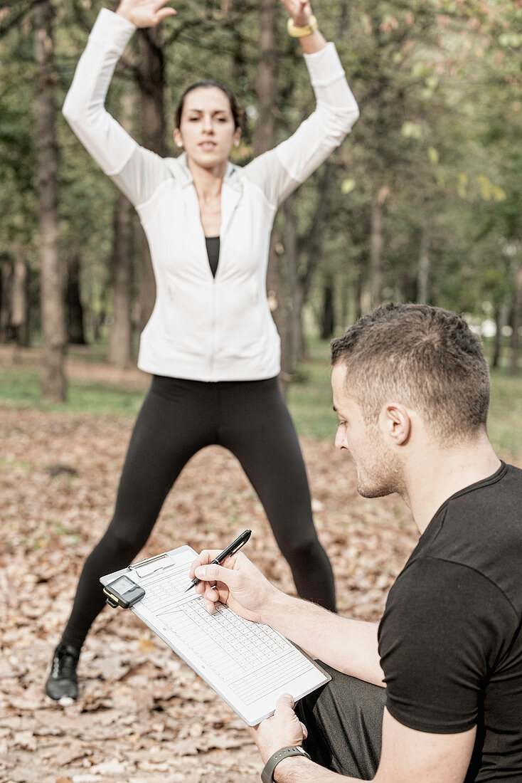 Woman working out with personal trainer