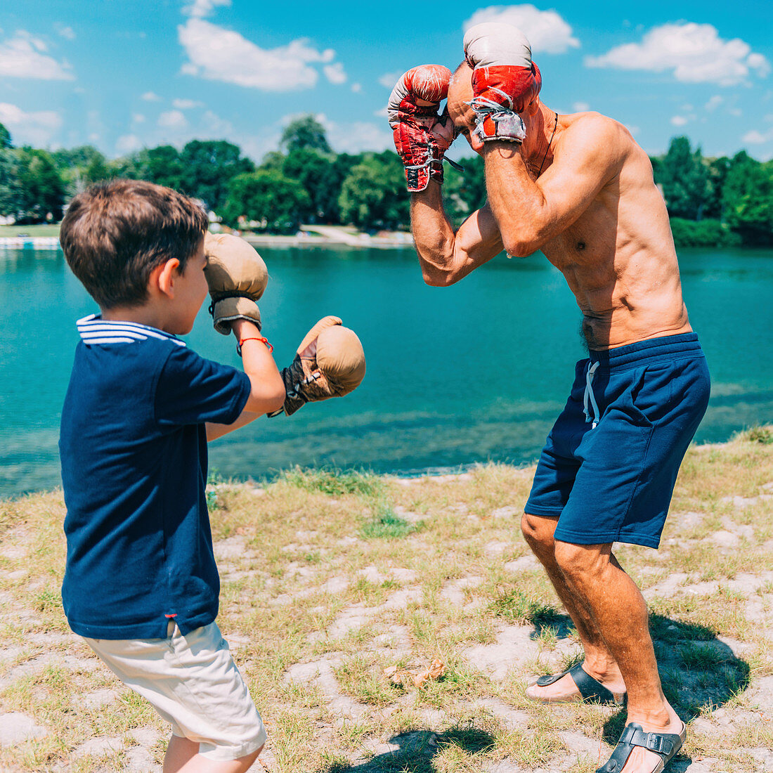 Grandfather and grandson boxing