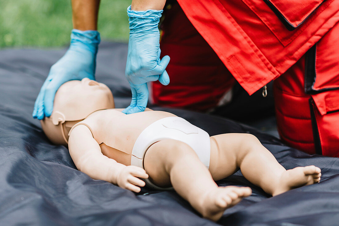 CPR training on baby dummy