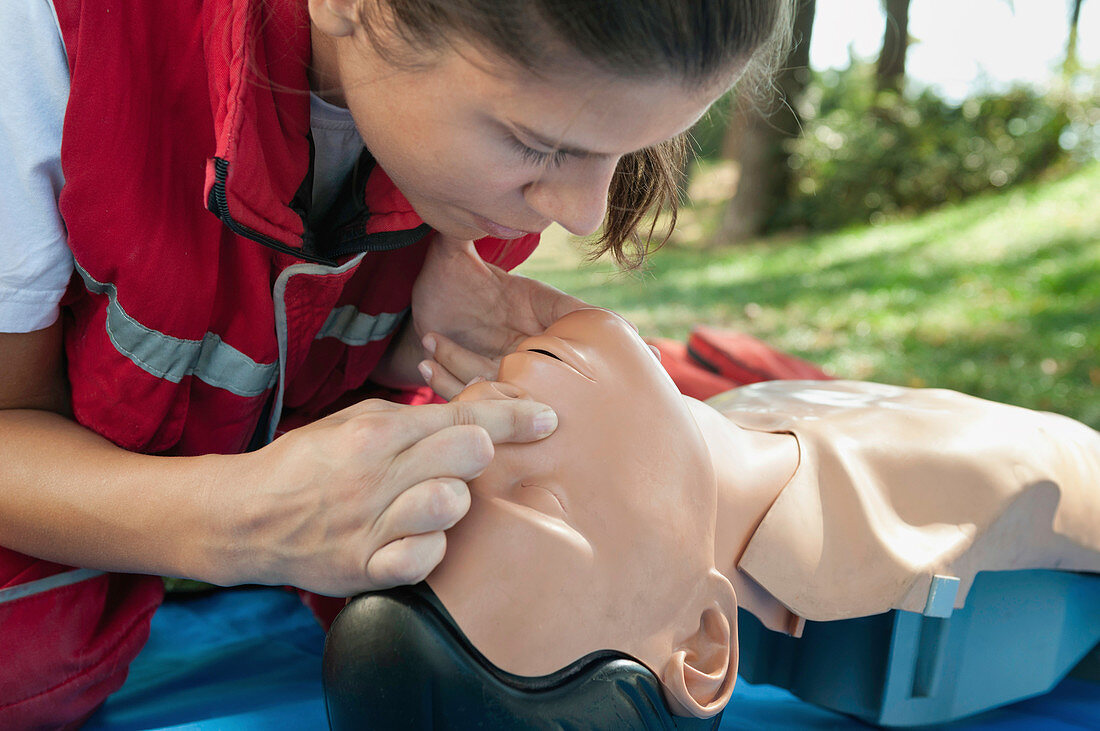 Rescue breaths on CPR dummy