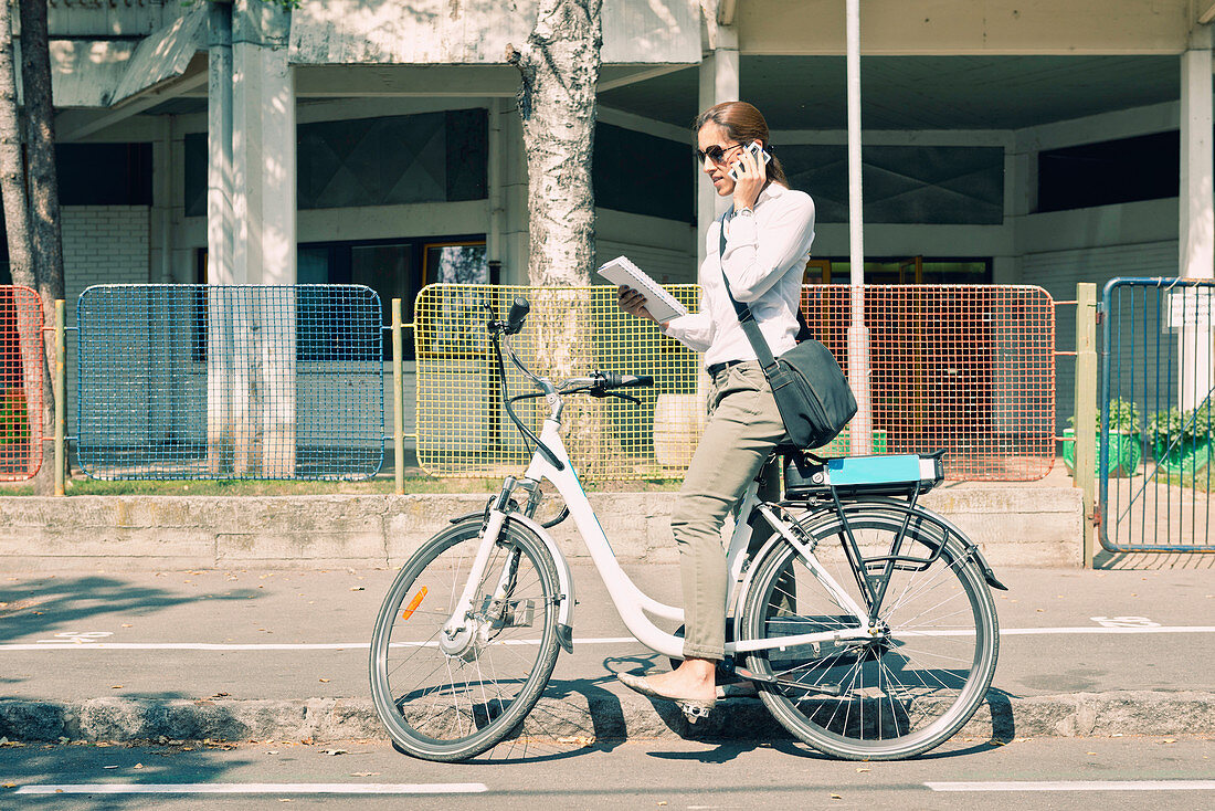 E-bike commuter on a business call