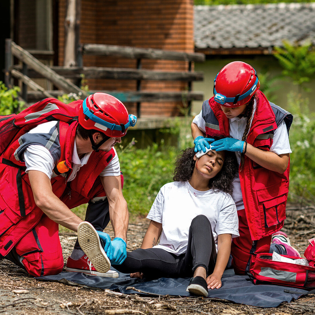 Rescue team helping injured woman