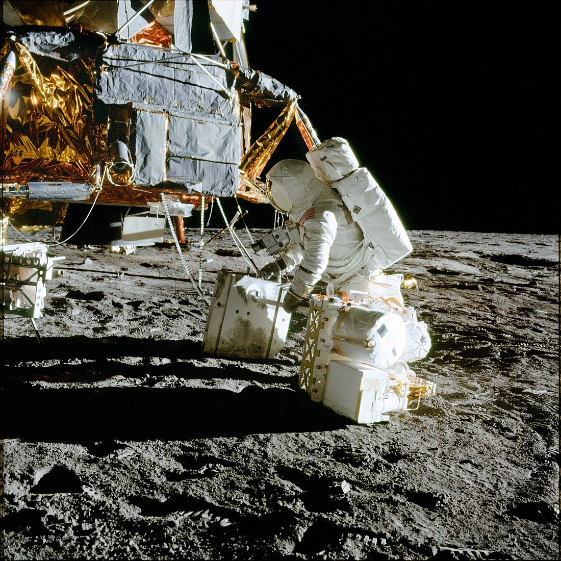 Apollo 12 astronaut in front of Lunar Module