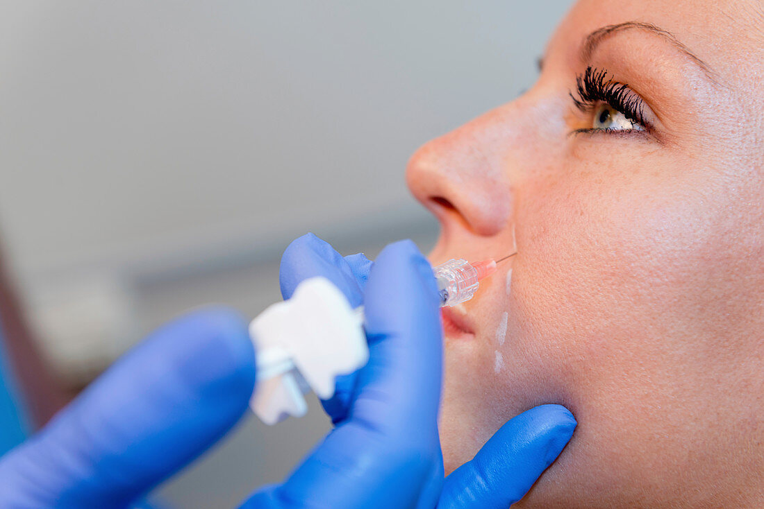 Woman having hyaluronic acid injections