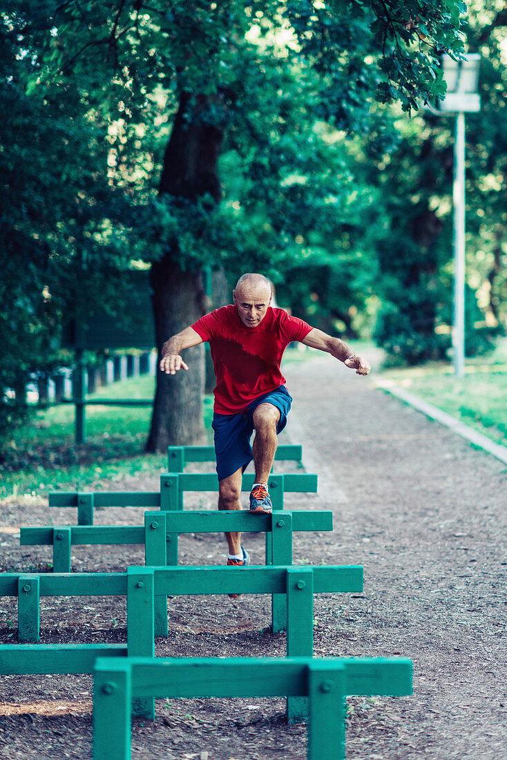 Fit senior man exercising in a park