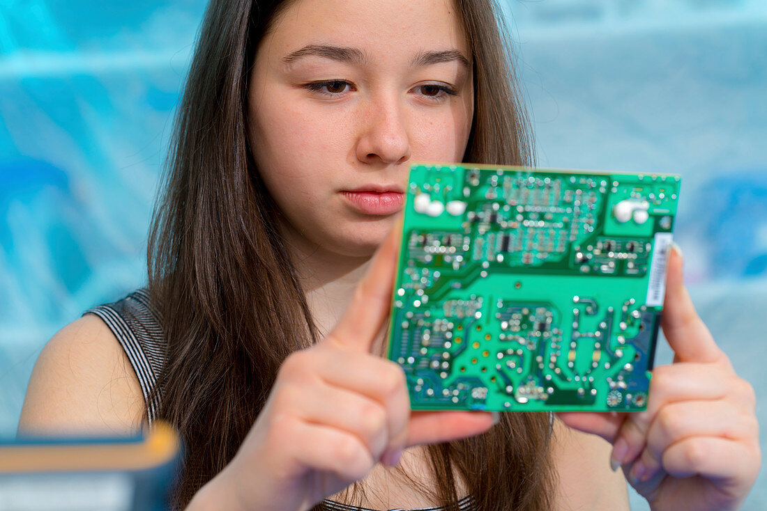 Girl working on electronics project