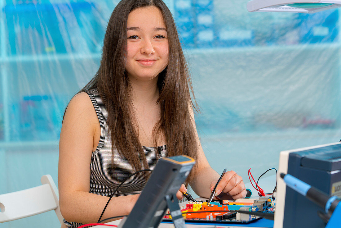 Girl working on electronics project