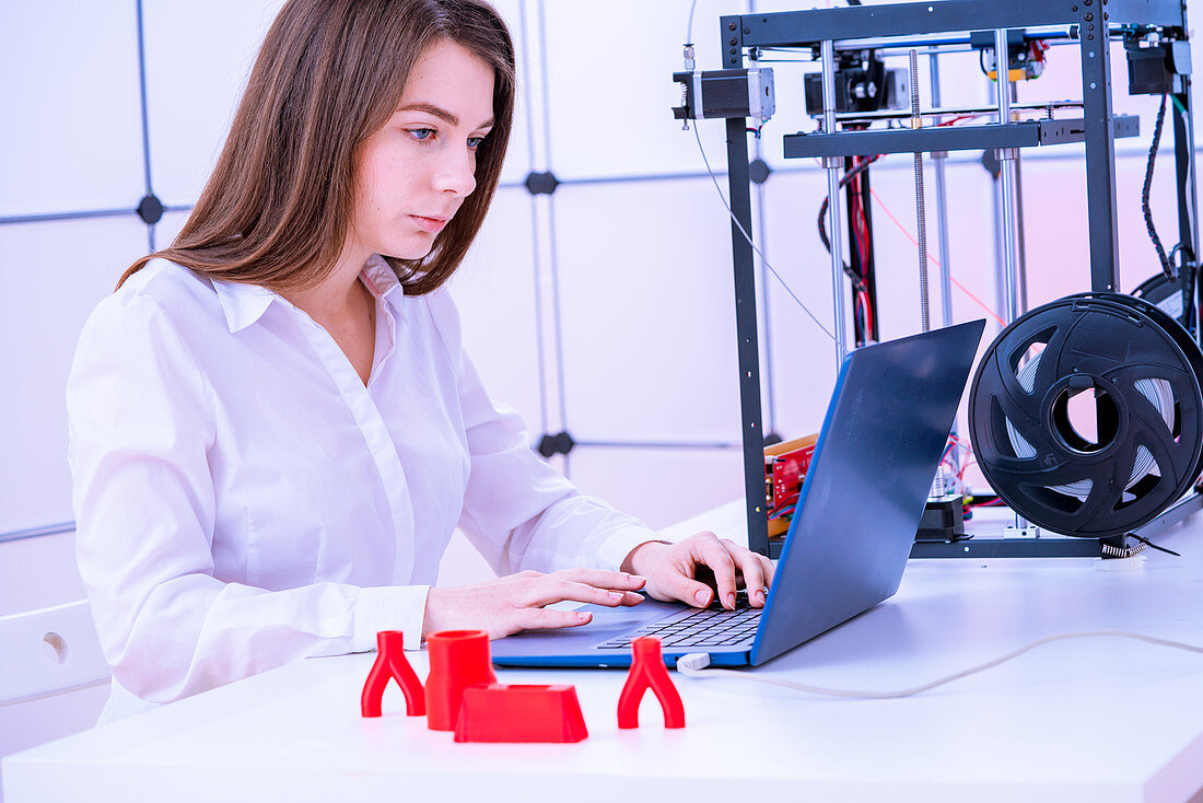 Designer working with 3D printer