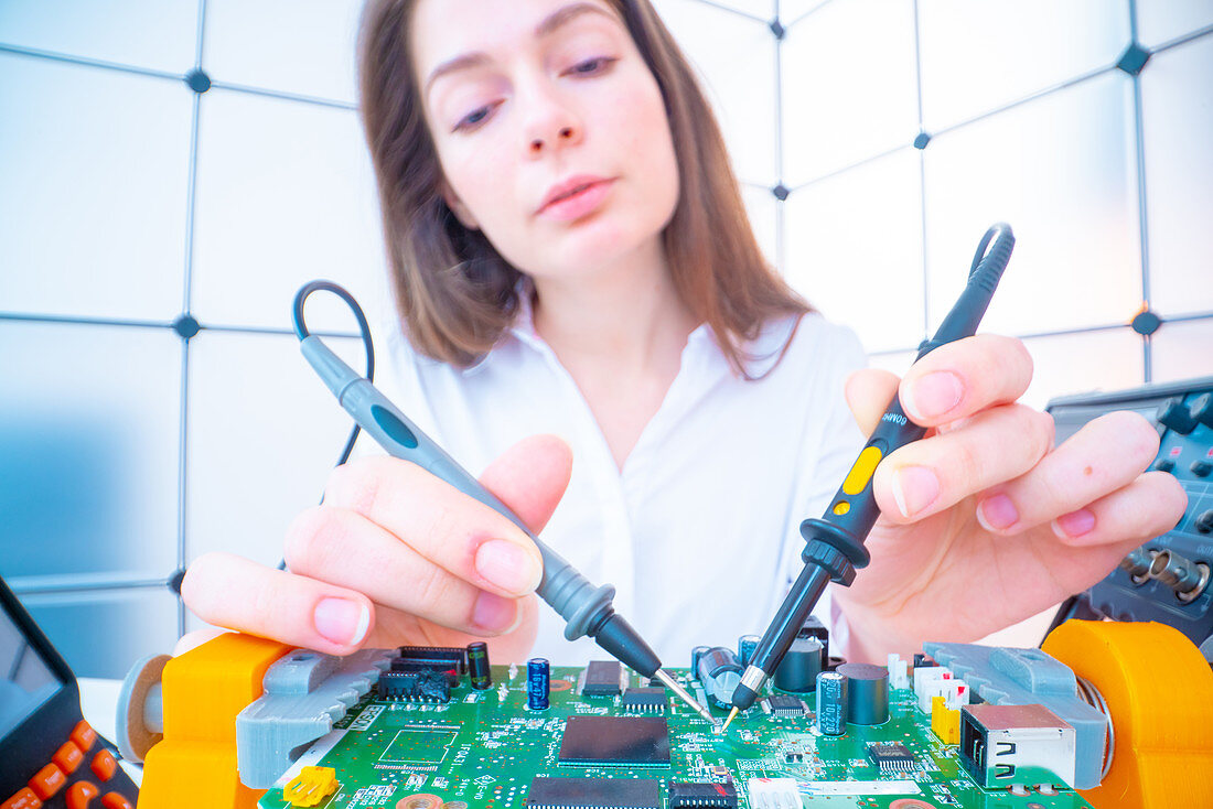 Engineer working on circuit board