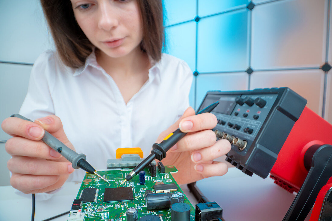 Engineer working on circuit board